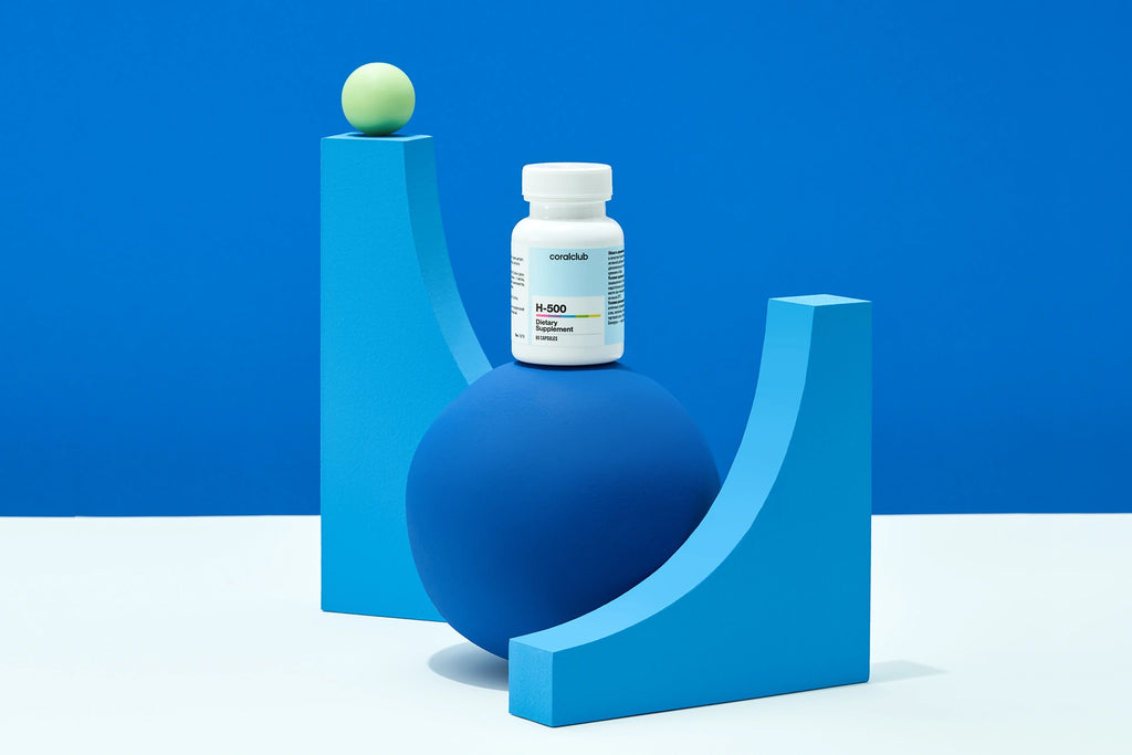 H-500 bottle on a blue sculptural display