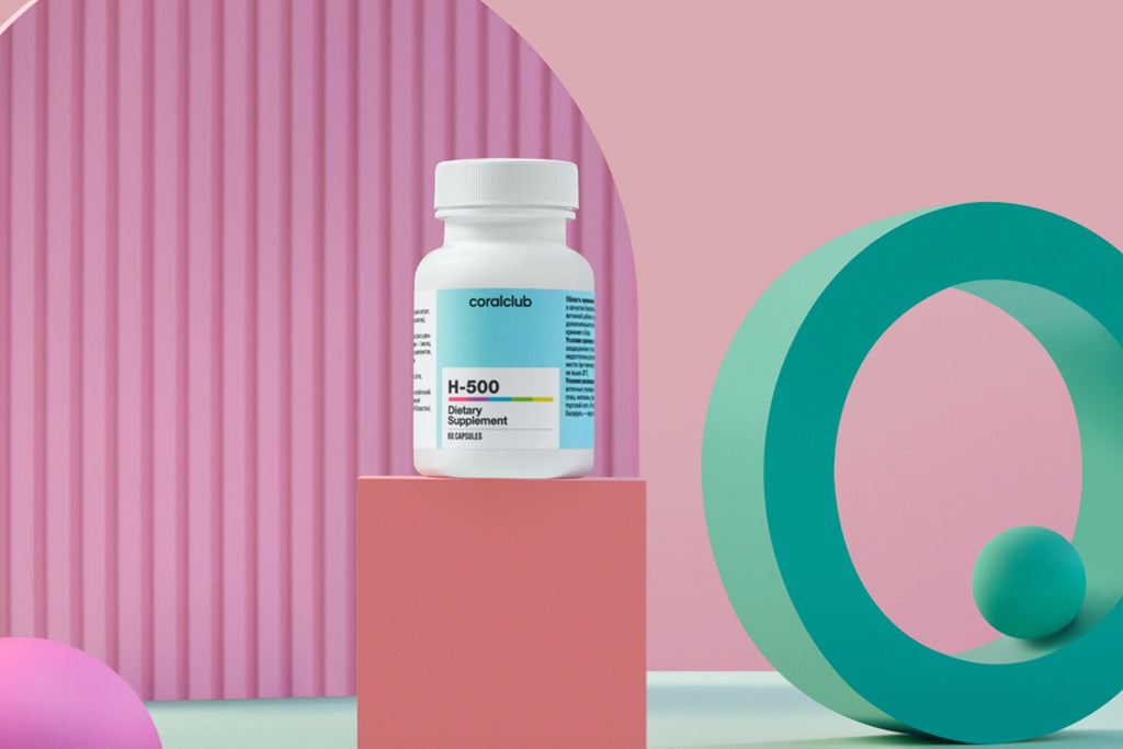 H-500 bottle on a pink and green geometric background